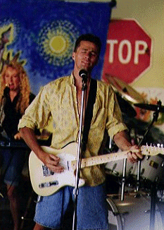 Sam playing guitar.